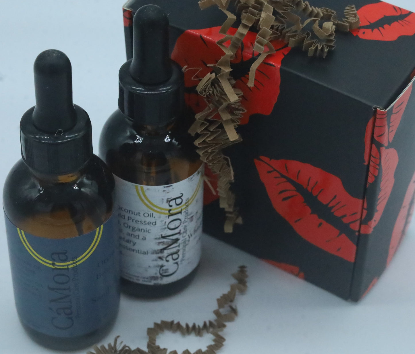 Two, 2 ounce bottles of the Ca'Mora organic beard oils.
