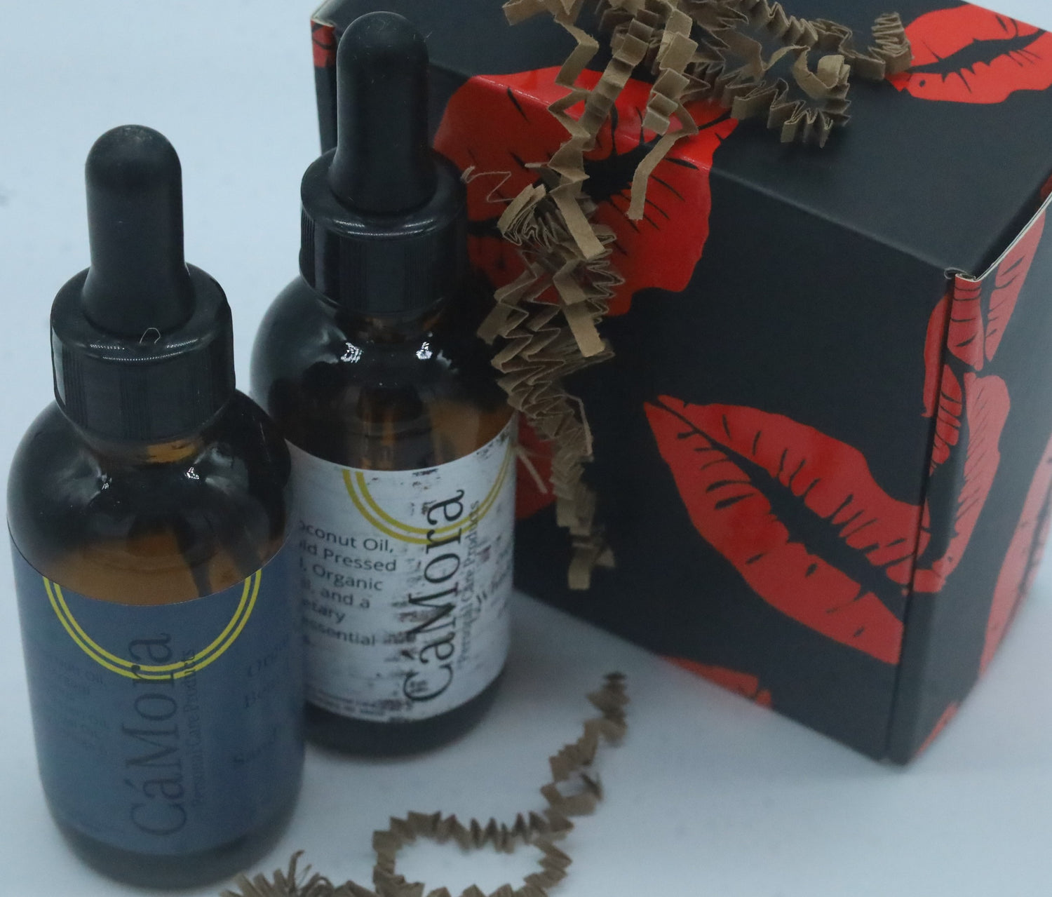 Two, 2 ounce bottles of the Ca'Mora organic beard oils.