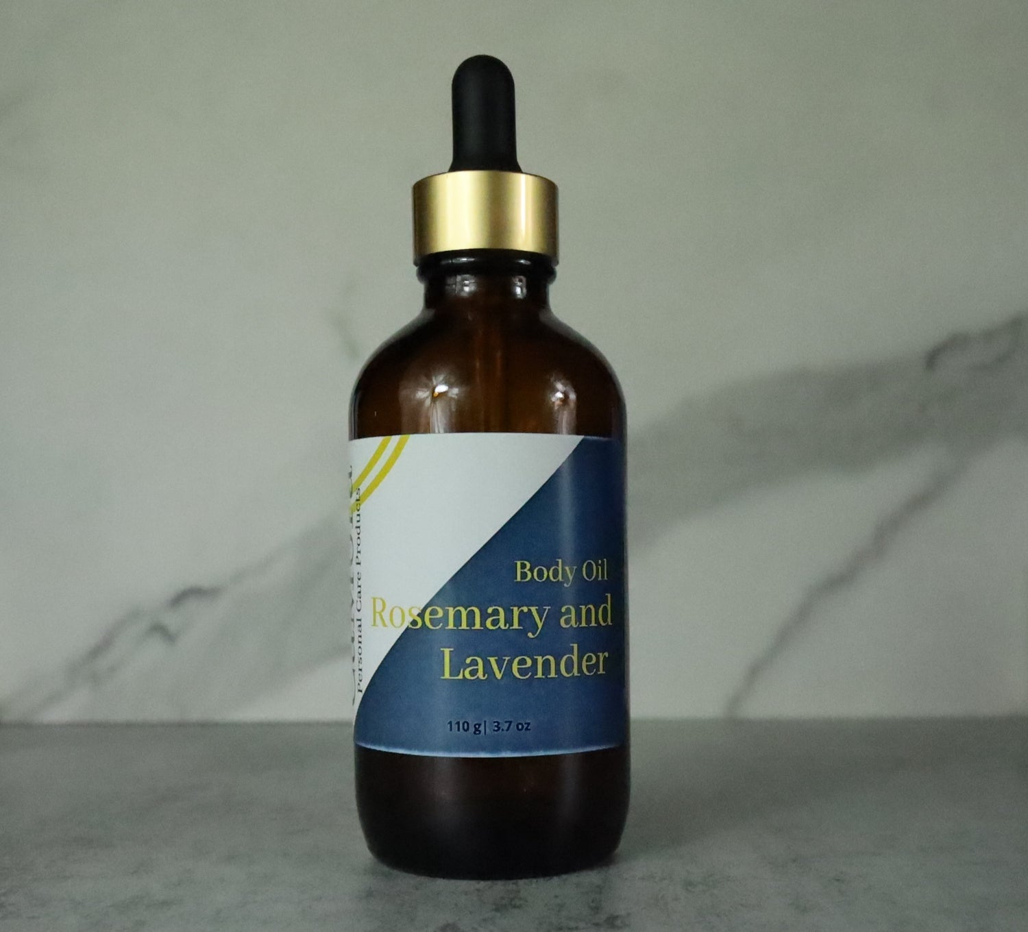 Ca'Mora Organic Rosemary and Lavender body oil.  4 ounce collage of bottles. Infused with organic Rosemary and lavender petals.